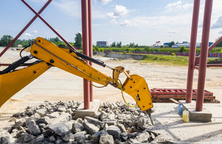Concrete demolition work in Dallas Texas by Best Dallas Demolition using hydraulic breaker