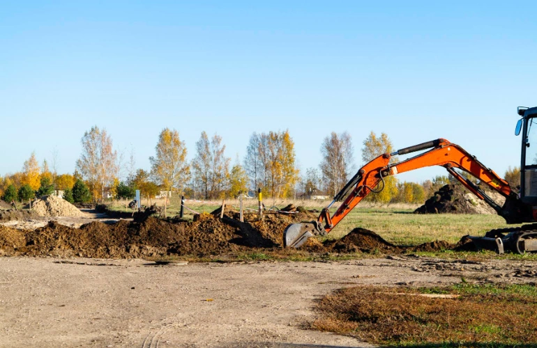 Land clearing service in Dallas Texas using excavator by Best Dallas Demolition